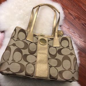 Coach F13533 Gold Signature Stripe Hand bag.